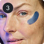 Woman's face with blue eye patch and number 3.