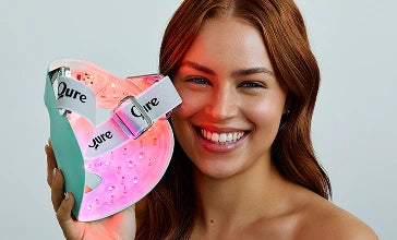 Woman holding Quure LED face mask