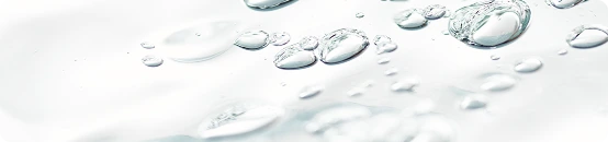 Caffeine bubbles in water, close up shot.