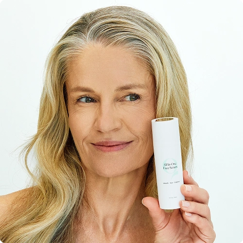 Woman with All-in-One Face Scrub serum.