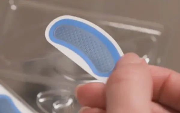 Preparing eye pad for application